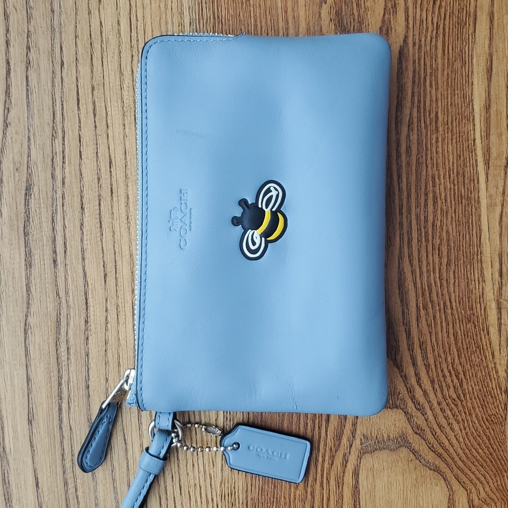 Azure Coach clutch with bee logo